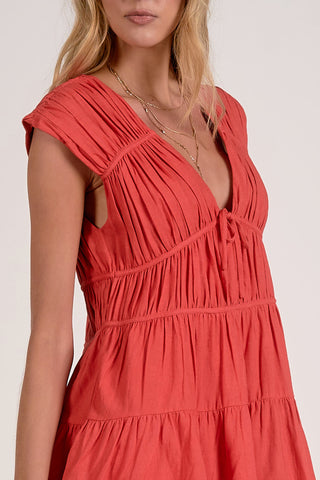 trendy coral mini dress for warm weather
women's summer dress for tropical vacation
boutique coral dress for summer events
romantic tiered mini dress for women
coral dress for date night and vacation