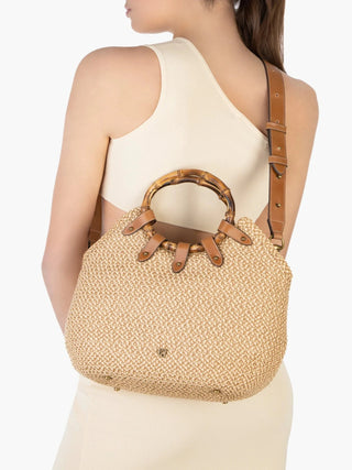 You dreamt it, Eric designed it!Chic mid-size resort-summer bag of stitched Squishee® straw braid balances elegance with function